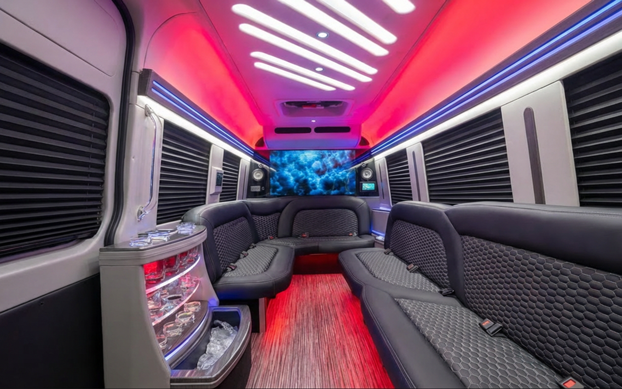 Still image of the Elite Nite Line van interior with red and blue lighting